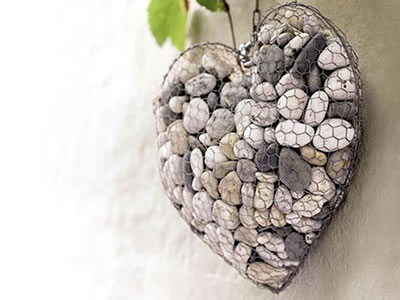 This is a heart-shaped hexagonal wire mesh filled with stones.