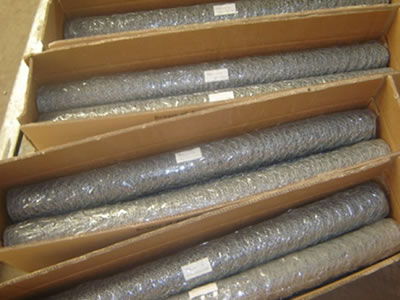 Hexagonal wire mesh is placed in carton with film plus label.